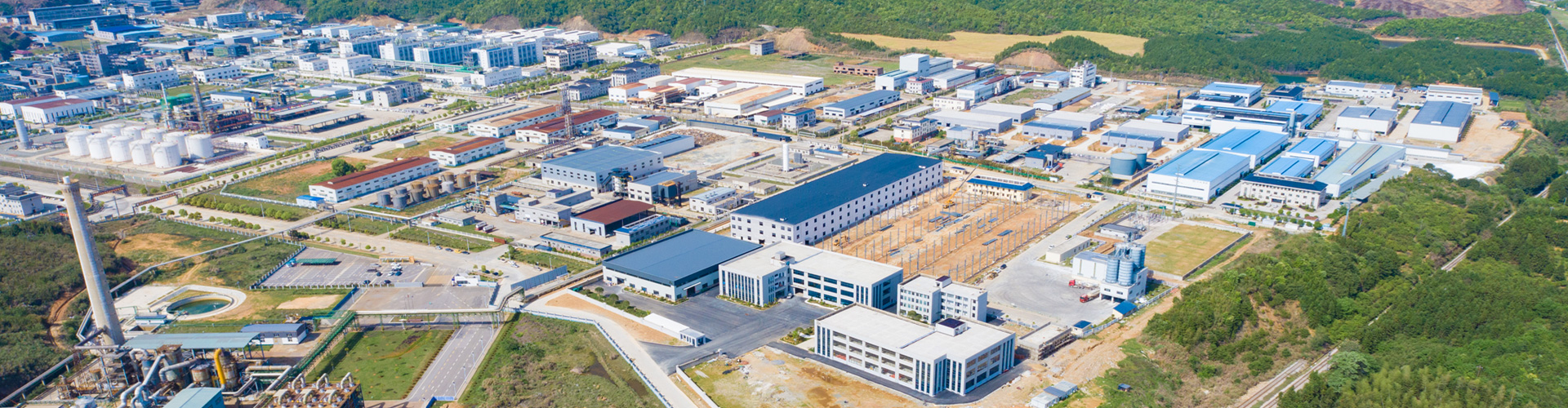 Aerial view of a factory complex with numerous buildings and facilities